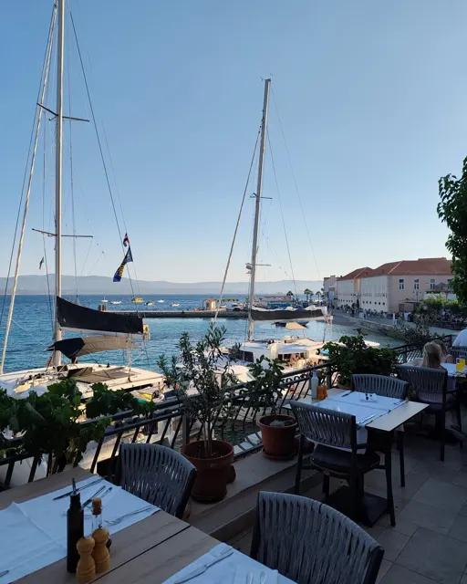 View over the marina and sailboats from the elevated terrace