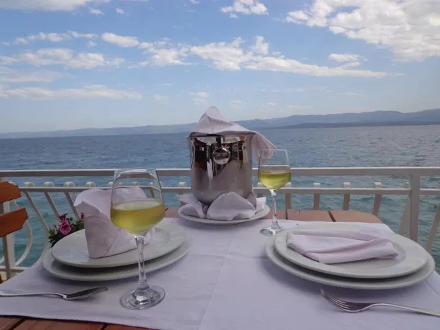 Table set with wine and sea view