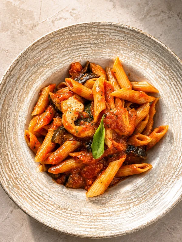 Penne in tomato sauce with eggplant and mozzarella